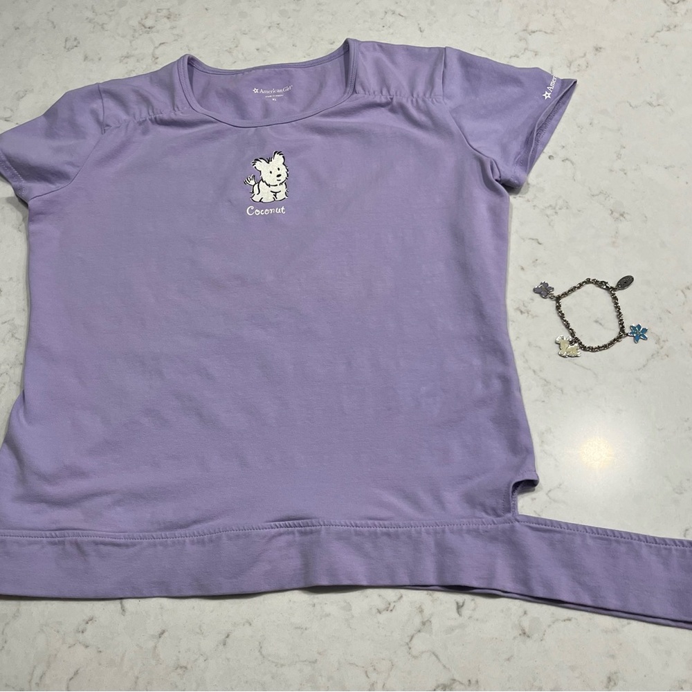 Original American Girl dog “Coconut” t-shirt with matching charm bracelet.